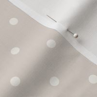 White polka dots on pale pastel taupe 