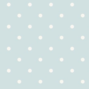 White polka dots on pale pastel blue green