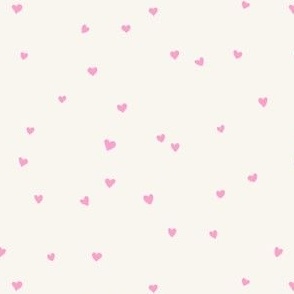 Scattered love hearts Valentine's Day in bubble gum pink on cream - SMALL SCALE