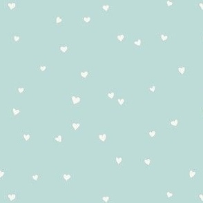 Scattered love hearts Valentine's Day in cream on light pastel blue  - SMALL SCALE