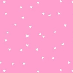 Scattered love hearts Valentine's Day in cream on bubble gum pink - SMALL SCALE