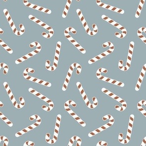 Christmas candy canes tossed brown/white on blue/grey