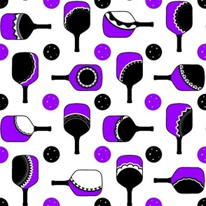 purple and white paddles with black and purple balls