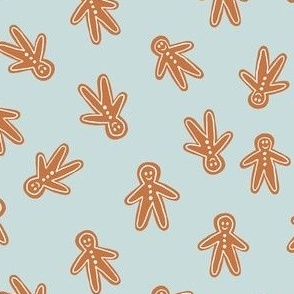 dark gingerbread men on ice winter blue