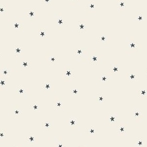 Tiny festive twinkle stars in dark blue