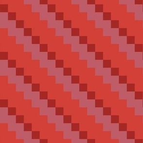 Small scale geometric diagonal checker stripe in multi red tones repeat pattern