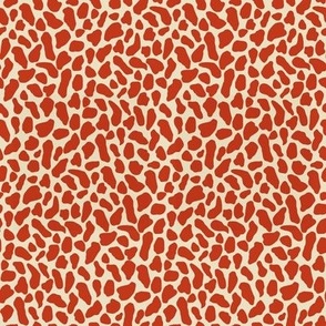 Small scale traditional and modern animal print in Vermilion red and Beige.