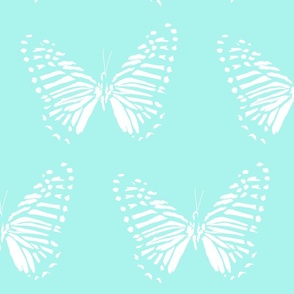 medium butterfly flight white on light turquoise