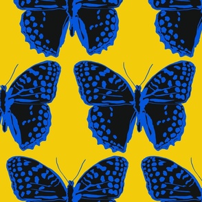 large spotted butterflies classic blue and black on gold