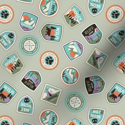 Dog adventures - tossed vintage springtime camping stickers and mountain badges with wet noses muddy paws and summer camp nature patches retro teal blue green orange on sage green