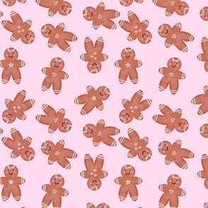 Cute gingerbread man cookie on pink  background