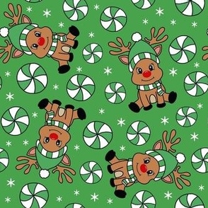 Medium Scale Red Nosed Reindeer and Peppermint Swirl Candy on Green