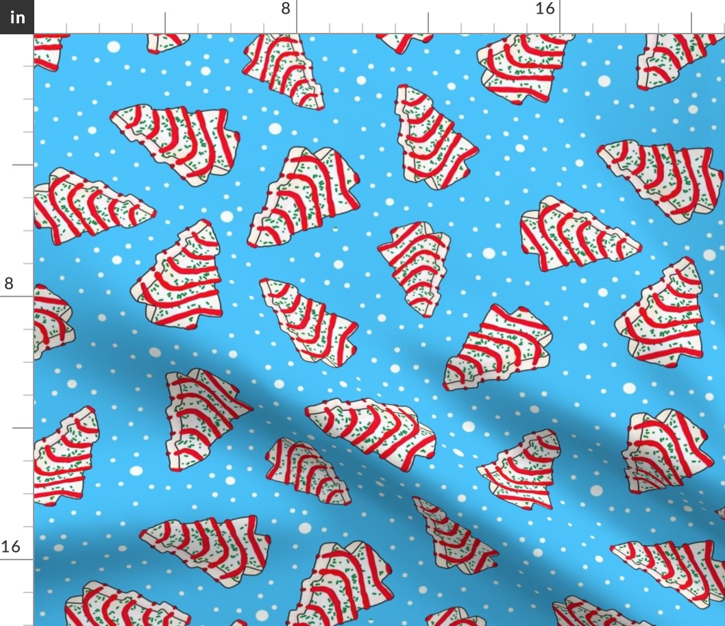 Large Scale Christmas Tree Frosted Snack Cakes on Bright Blue