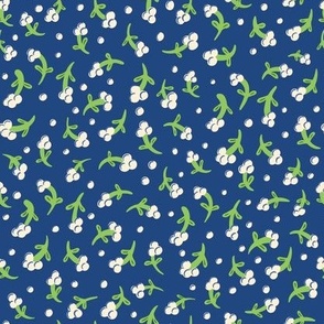 Small cream white flower silhouette on blue