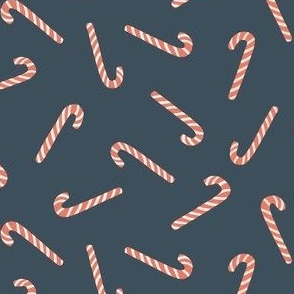 christmas candy canes on dark blue