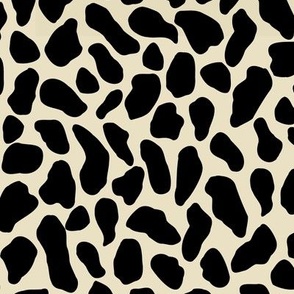 Large scale traditional and modern animal print in onyx black and beige.