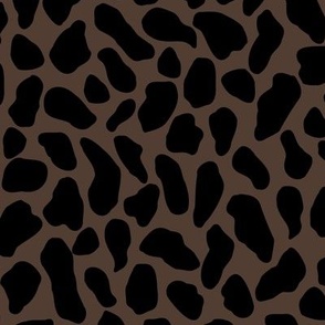 Large scale traditional and modern animal print in dark onyx black and dark russet brown.