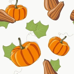 Bright pumpkins with green leaves