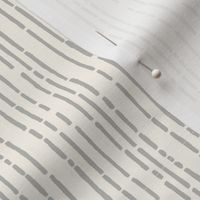 Small Dot and Dash hand drawn broken lines stripe in light warm grey on pale ecru cream