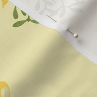 Hand drawn classic Christmas  mistletoe sprigs on creamy pale yellow  with  yellow ribbon