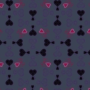 Gothic style design with calligraphy swirls and hearts, in greys, purples and reds “Wicca Love”