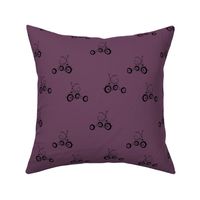 Vintage iconic toys - kids tricycle cute retro seventies style bike black on berry purple