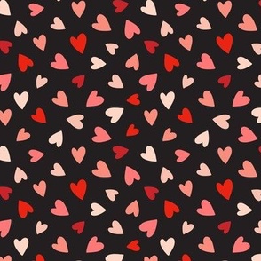 Red and pink hearts tossed on black 4x4