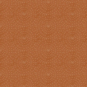 Dots in circle on tan small scale