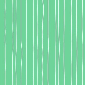 Thin white irregular vertical pin stripes on mint green