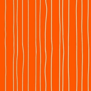 Thin white irregular vertical pin stripes on orange
