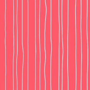 Thin white irregular vertical pin stripes on deep pink