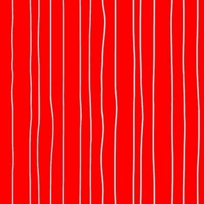 Thin white irregular vertical pin stripes on red