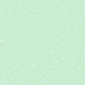 snow flurries on mint green