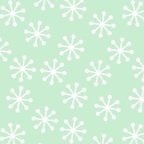 white snowflakes on mint green background