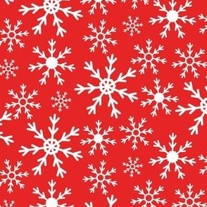 white snowflakes on red background