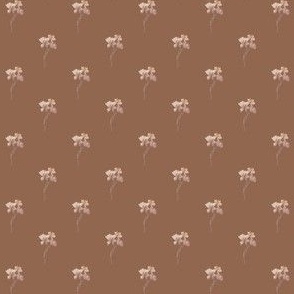 Dainty Peach flowers with a burnt orange, terracotta background