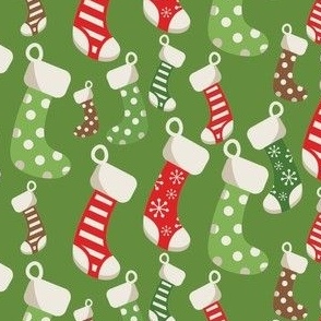 christmas stockings on green