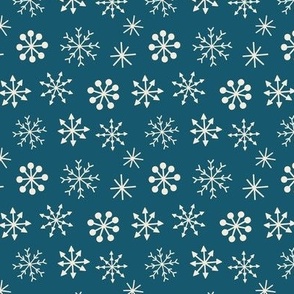 white snowflakes on navy blue