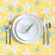 White and aqua star fish on yellow background - large