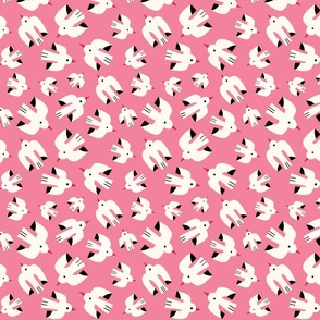 Flock of white birds flying through the summer sky on a pink background - small scale