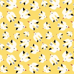 Flock of white birds flying through the summer sky on a yellow background - middle scale