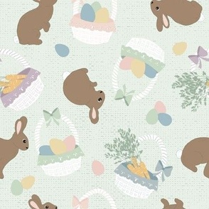 Easter Bunnies and Baskets with carrots and eggs on green texture background