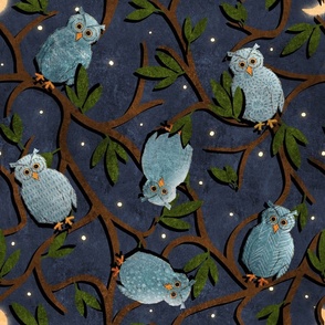 owls in a tree at night