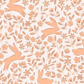 Leaping Rabbits in the Meadow in Peach Fuzz