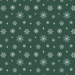 White snowflakes and pale yellow stars against a forest green background
