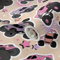 Cool toy monster trucks with stars and lightning comic detailing girls cars design pink lilac peach on cream sand