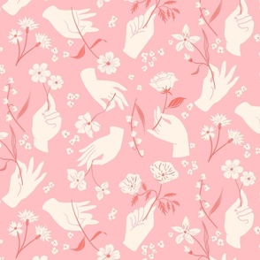 Hands holding flowers in pink and cream