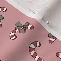 Little candy cane present and bows christmas design red green on blush vintage palette  