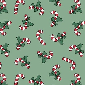 Little candy cane present and bows christmas design red green on sage green vintage palette  