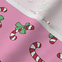 Little candy cane present and bows christmas design red mint green on pink nineties girls palette  